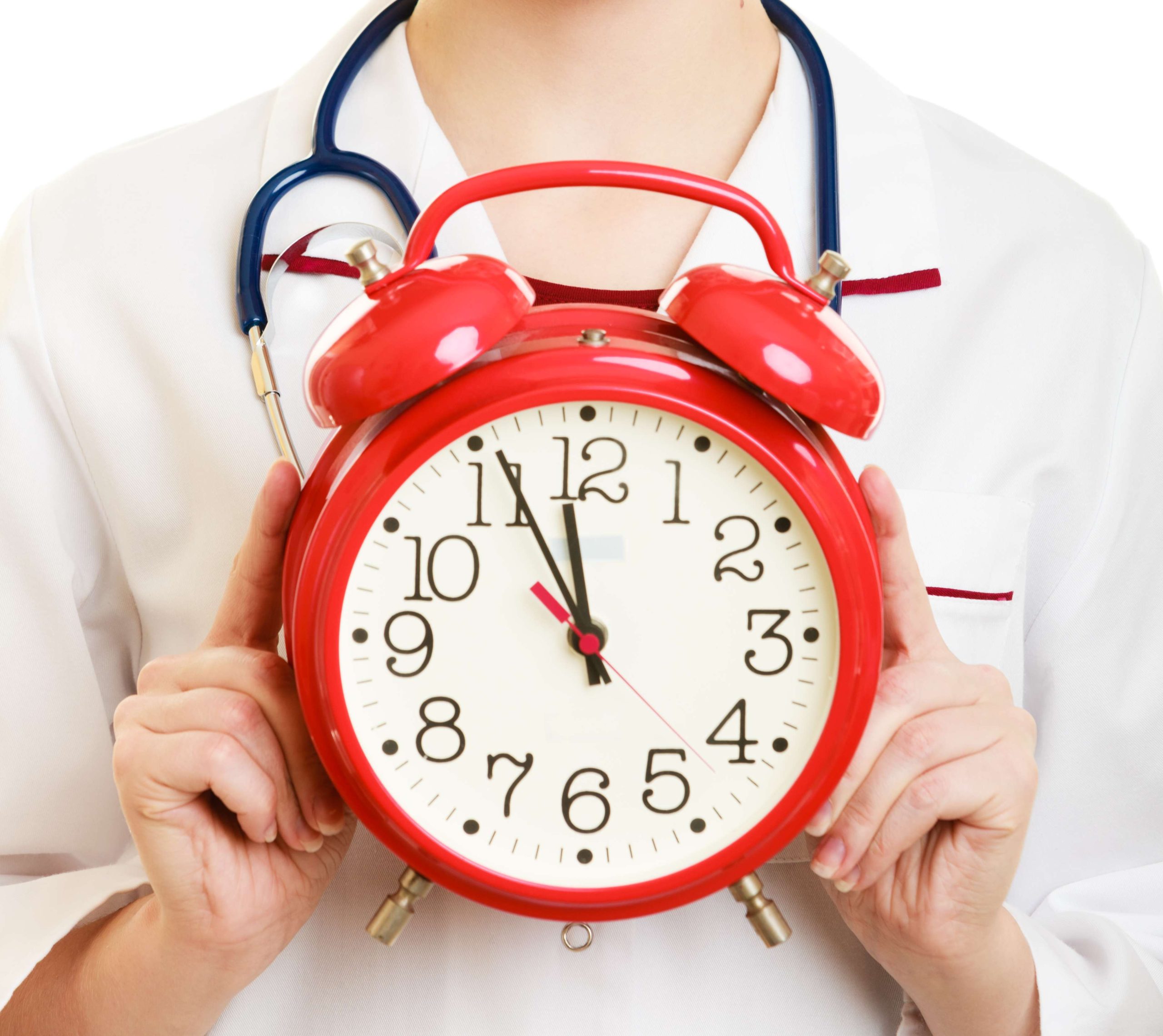 Woman doctor with clock isolated on white