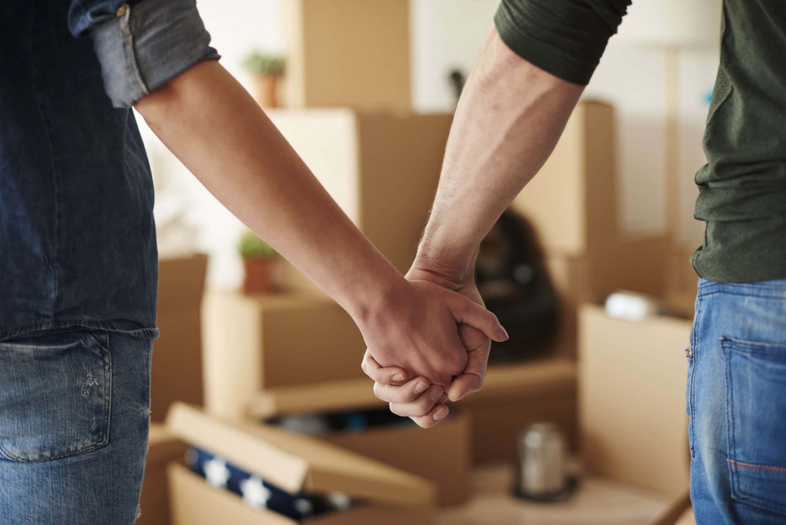 Close up of couple holding hands