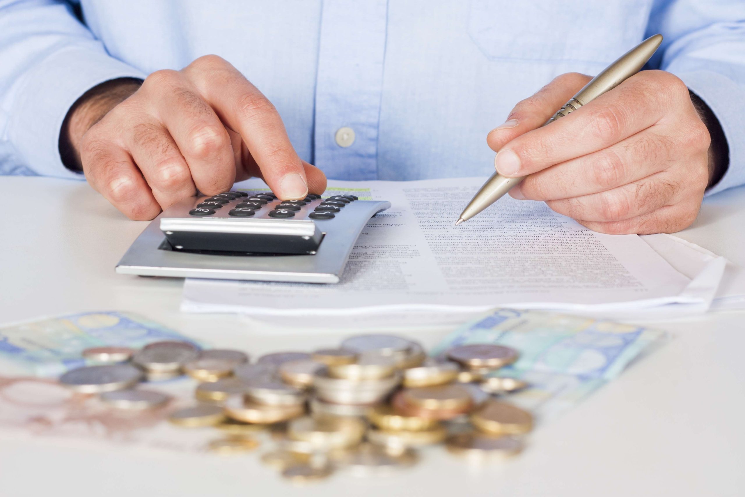 Business men working with documents and calculator  in the office